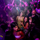 People drink on the dance floor shortly after the midnight reopening of The Piano Works in Farringdon, in London, Monday, July 19, 2021.